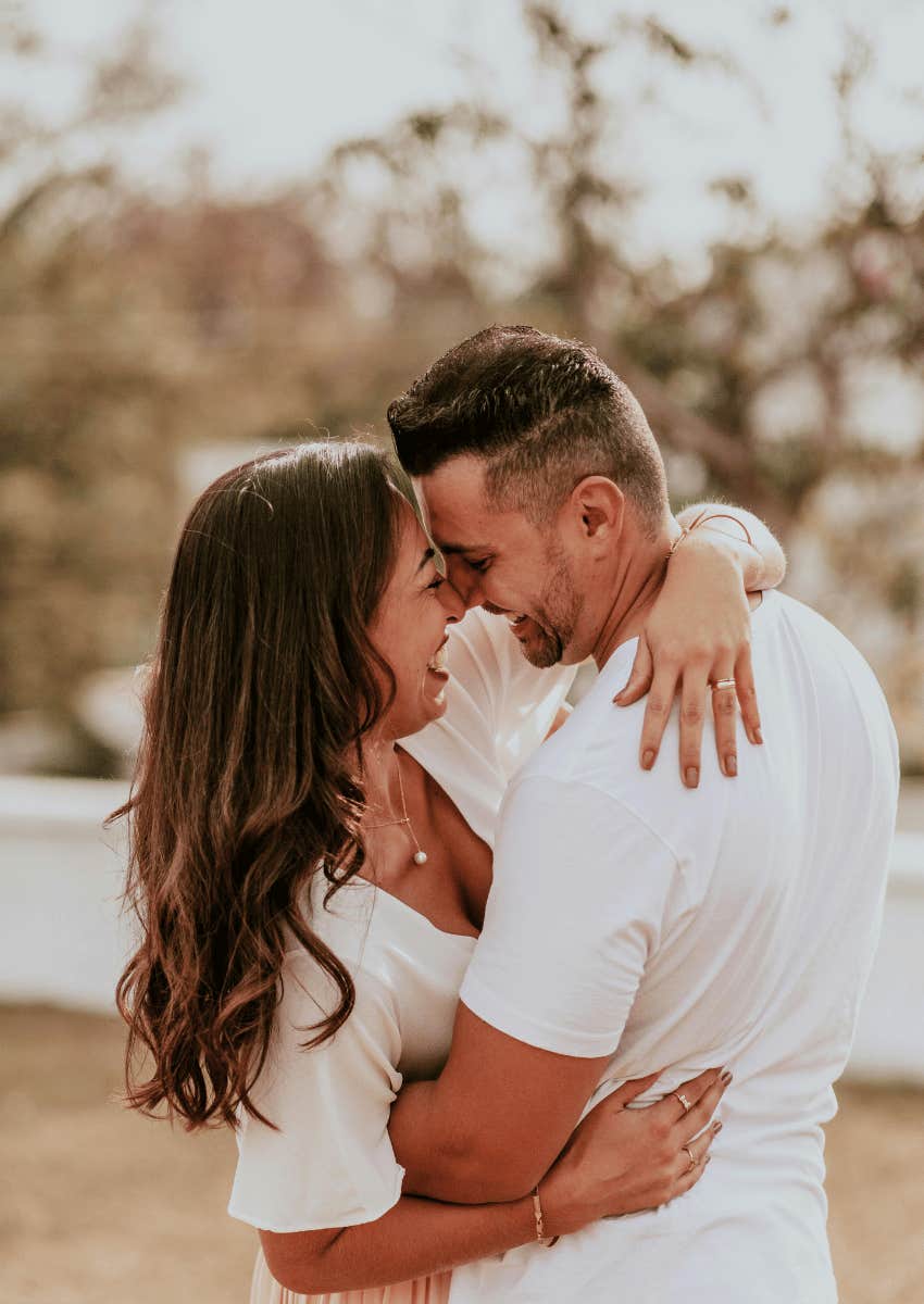 loving couple hugging each other close