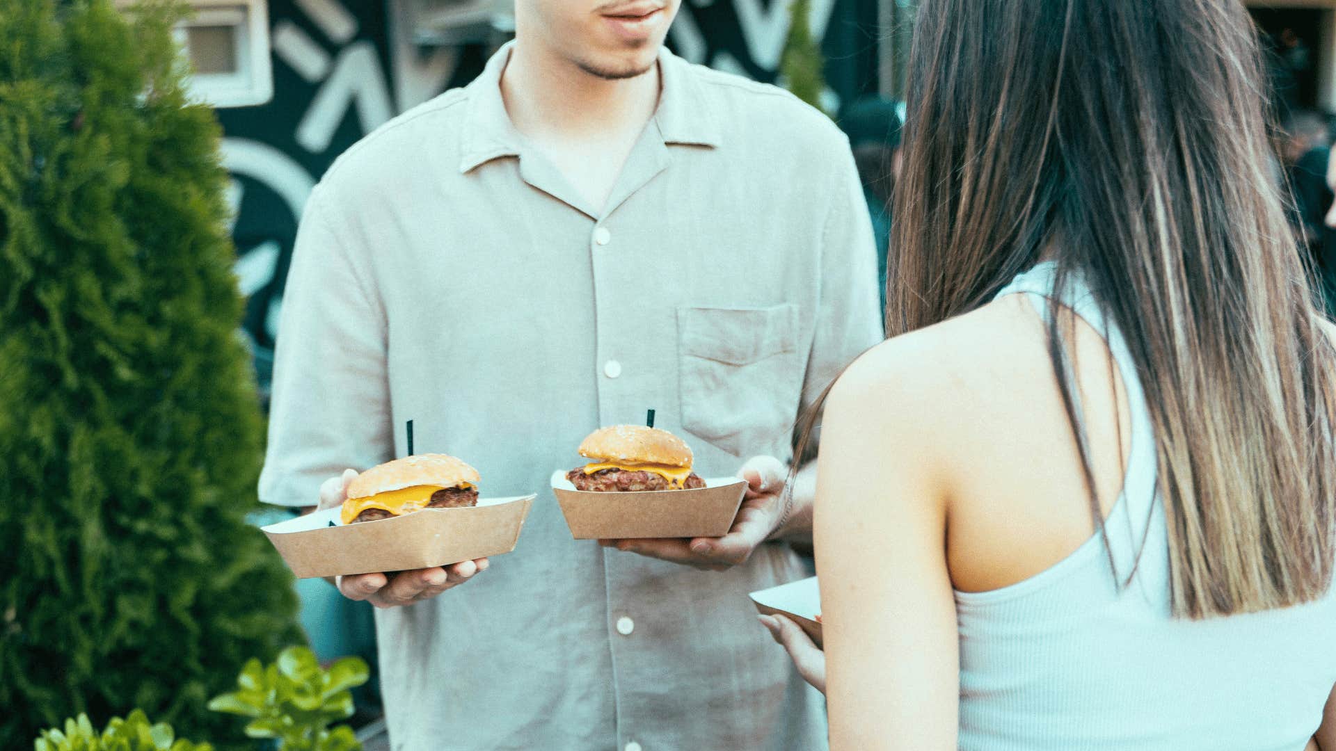 low-effort man ordering food for woman