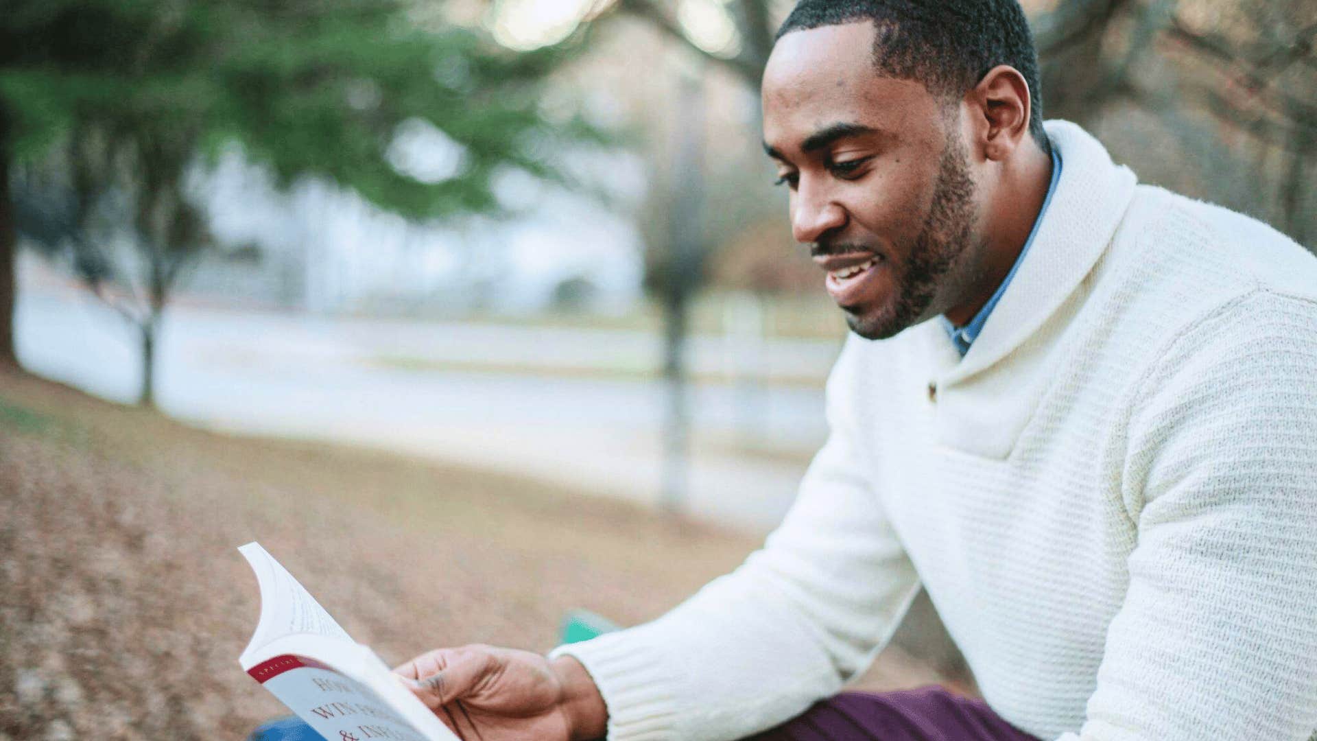 man reading outdoors improving awareness 