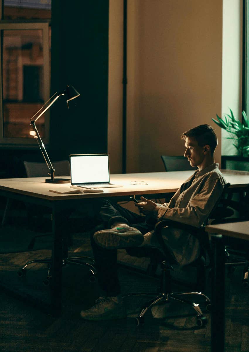 man staying at work late