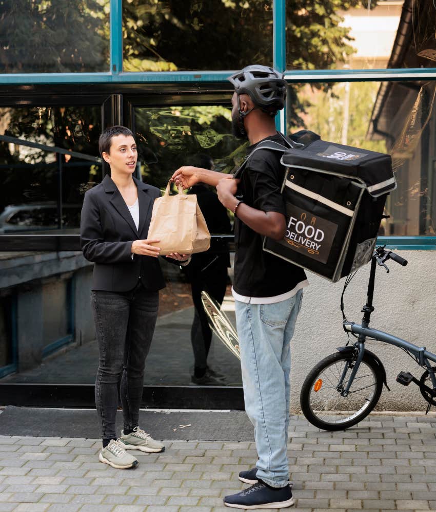 delivery driver handing food to customer
