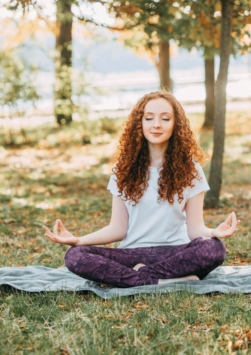 young woman meditating hobby