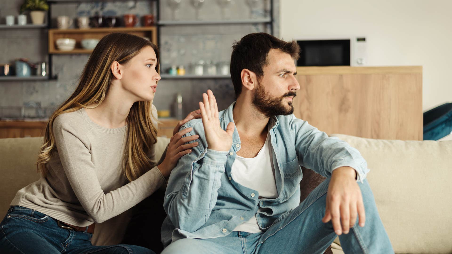 man ignoring wife not wanting to be affectionate