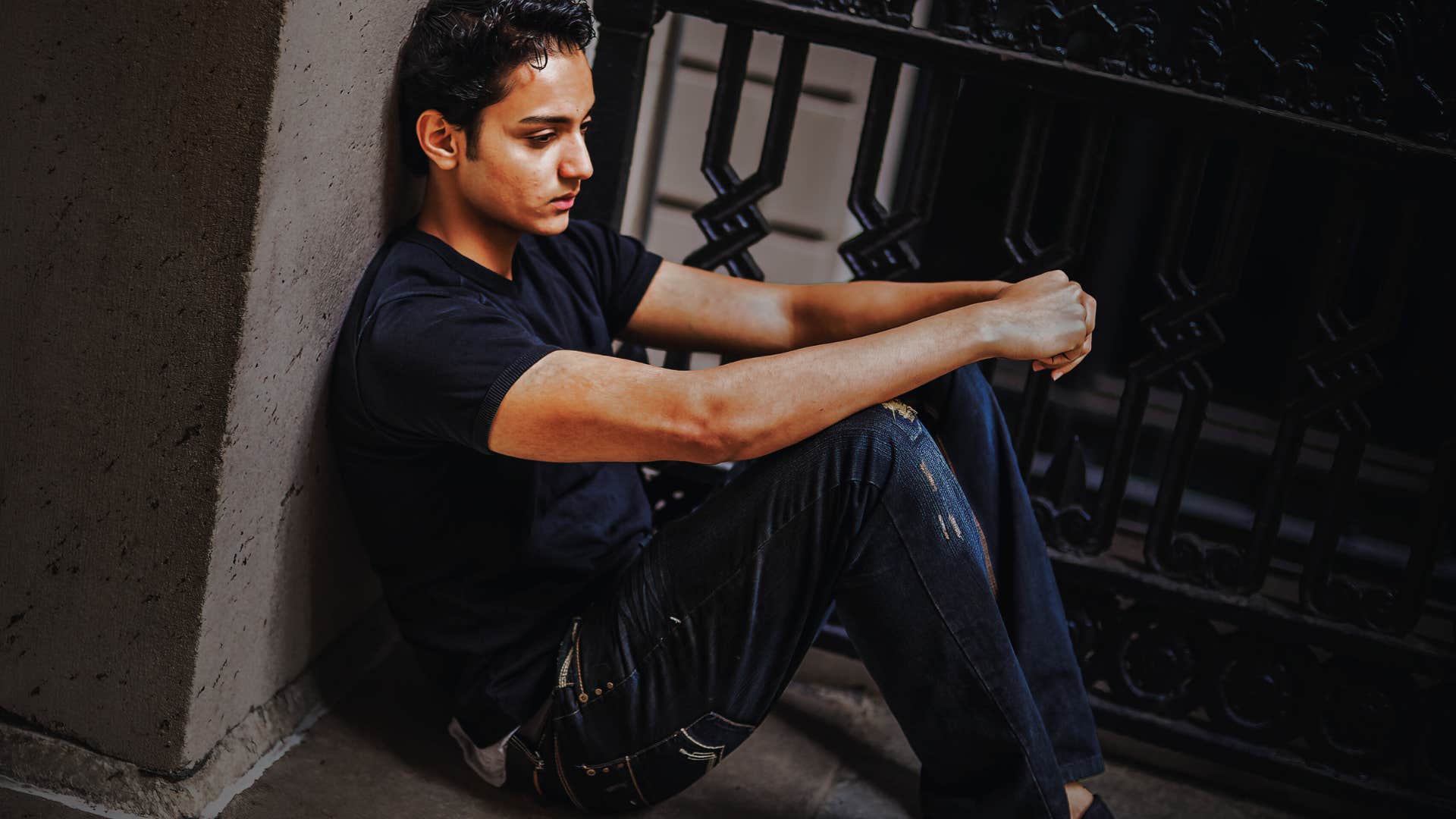 man showing his feelings through shutting himself away