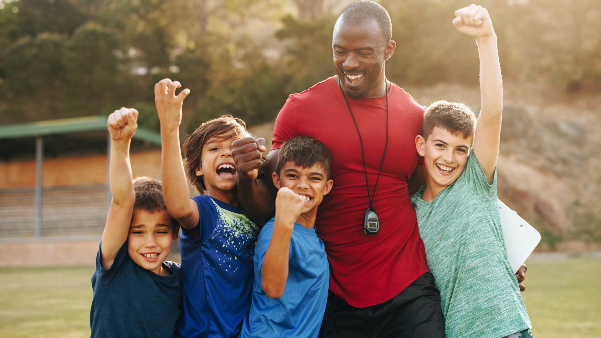 excited young kids participating in extracurricular activities with a teacher