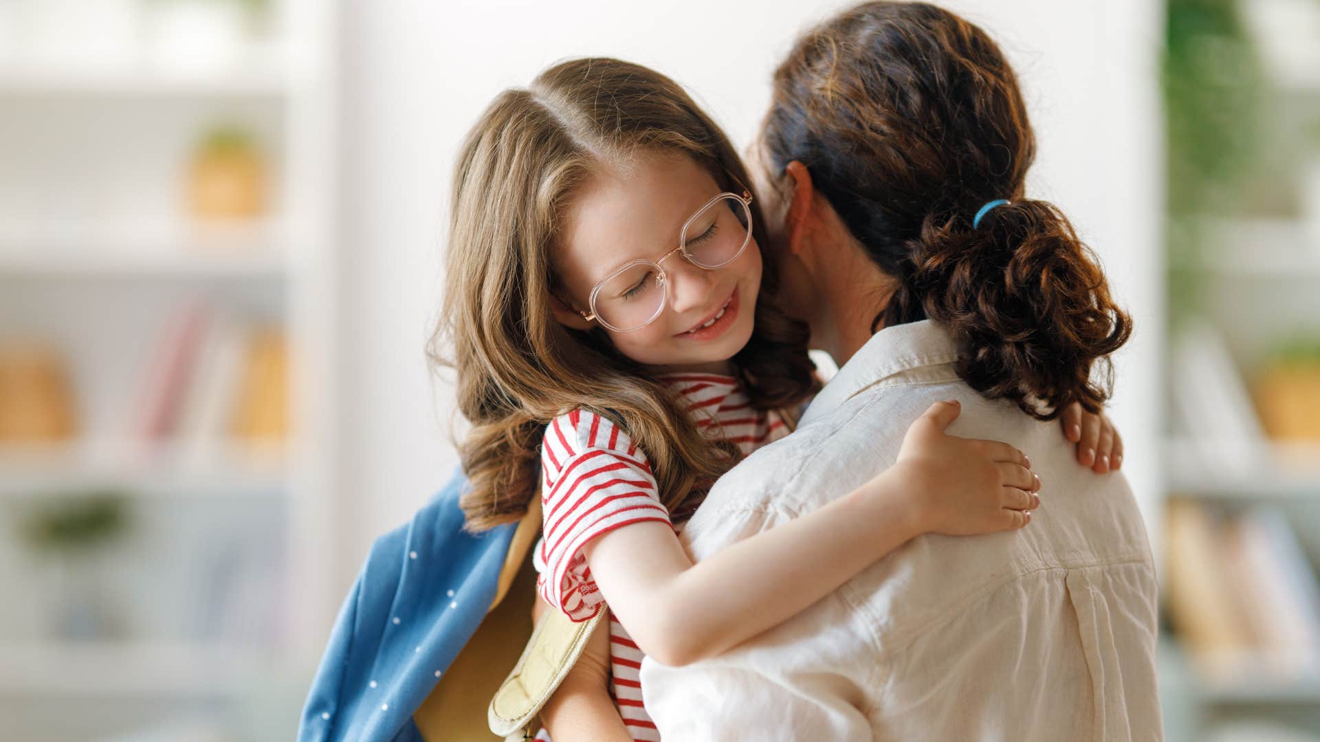 little girl smiling about having a parent come to school