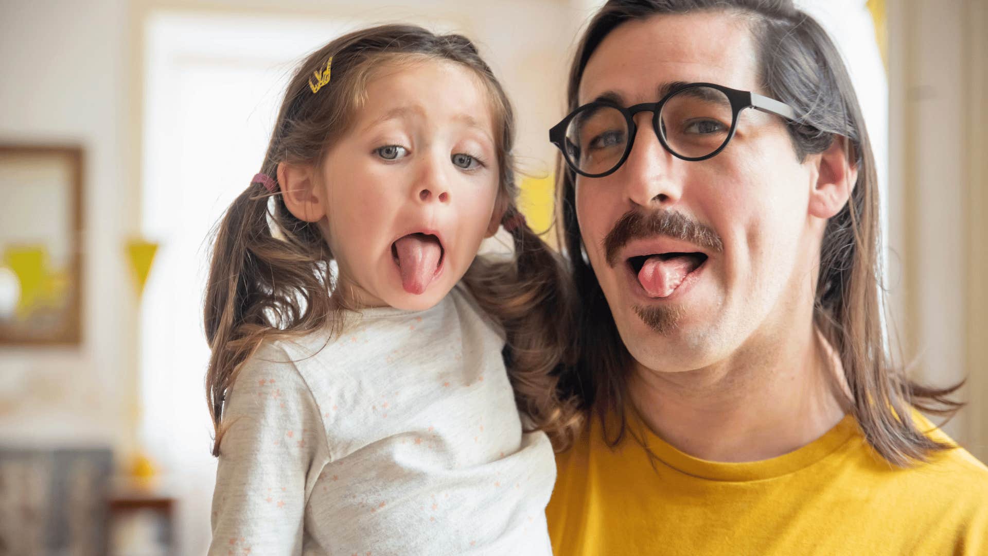 modern parent enjoying kid's silliness