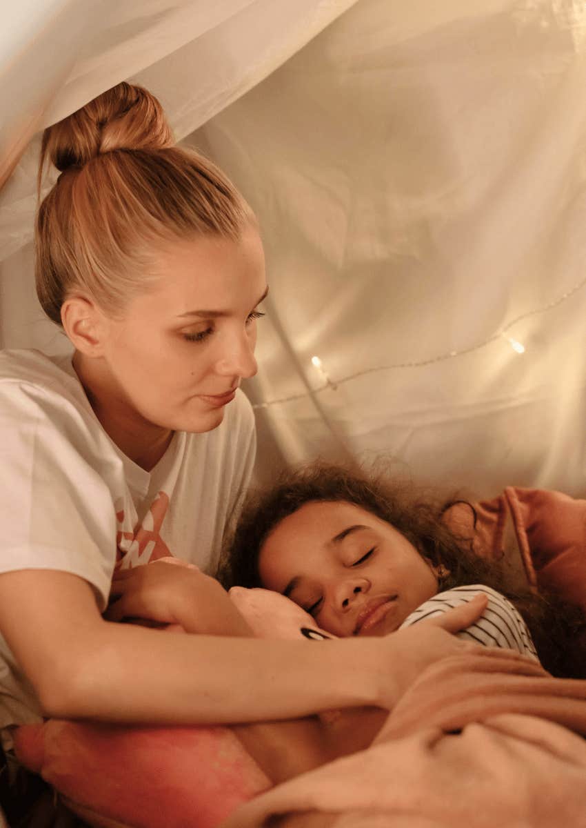 mom comforting her sleeping child