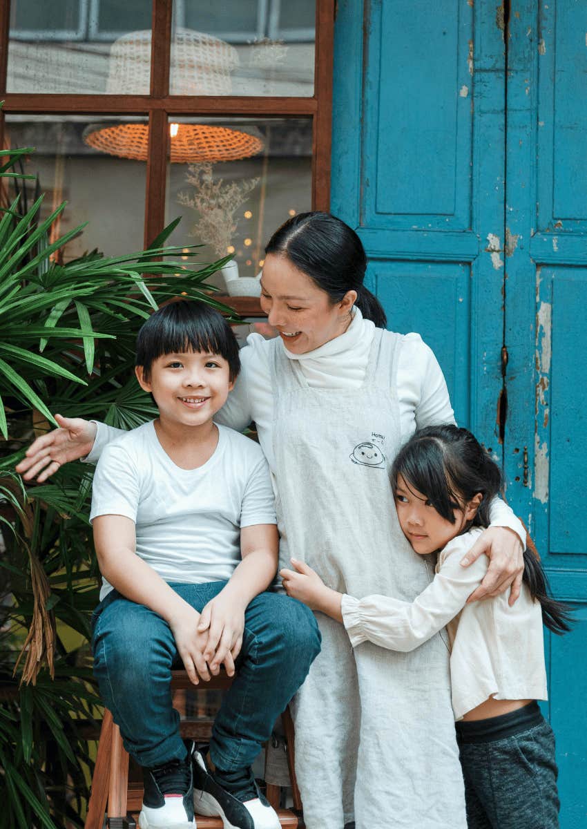 mom hugging her children close