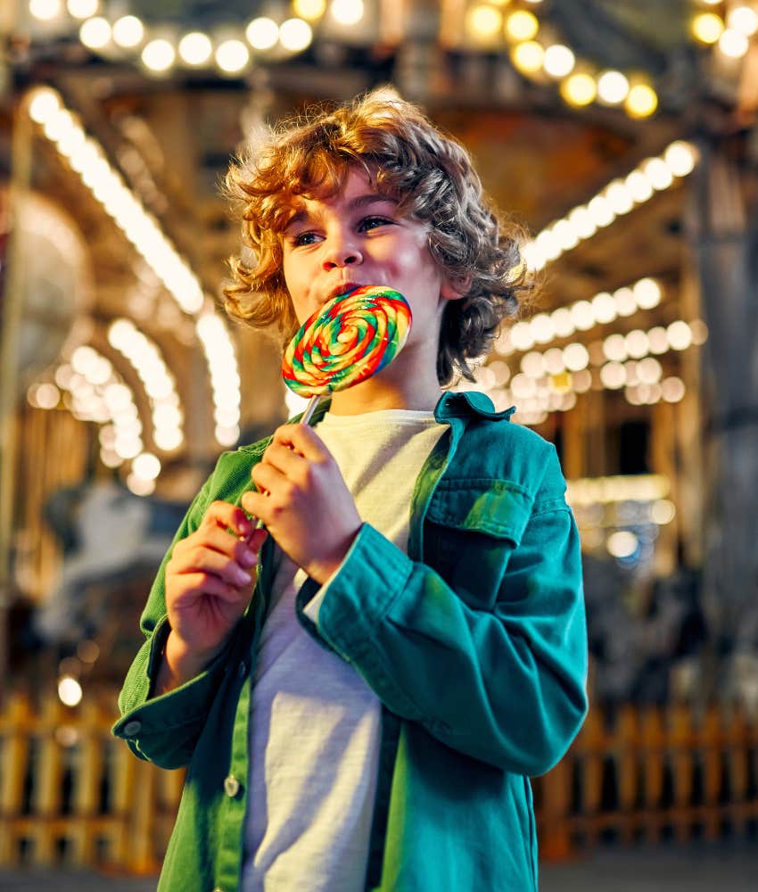 Happy child chooses large candy showing parenting mistake