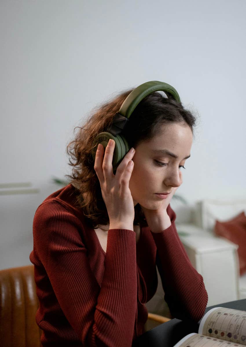 woman listening to music while stressed