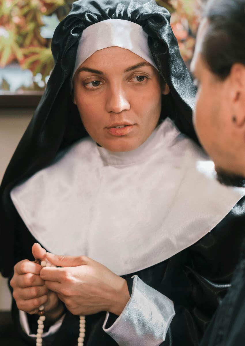 nun holding a rosary