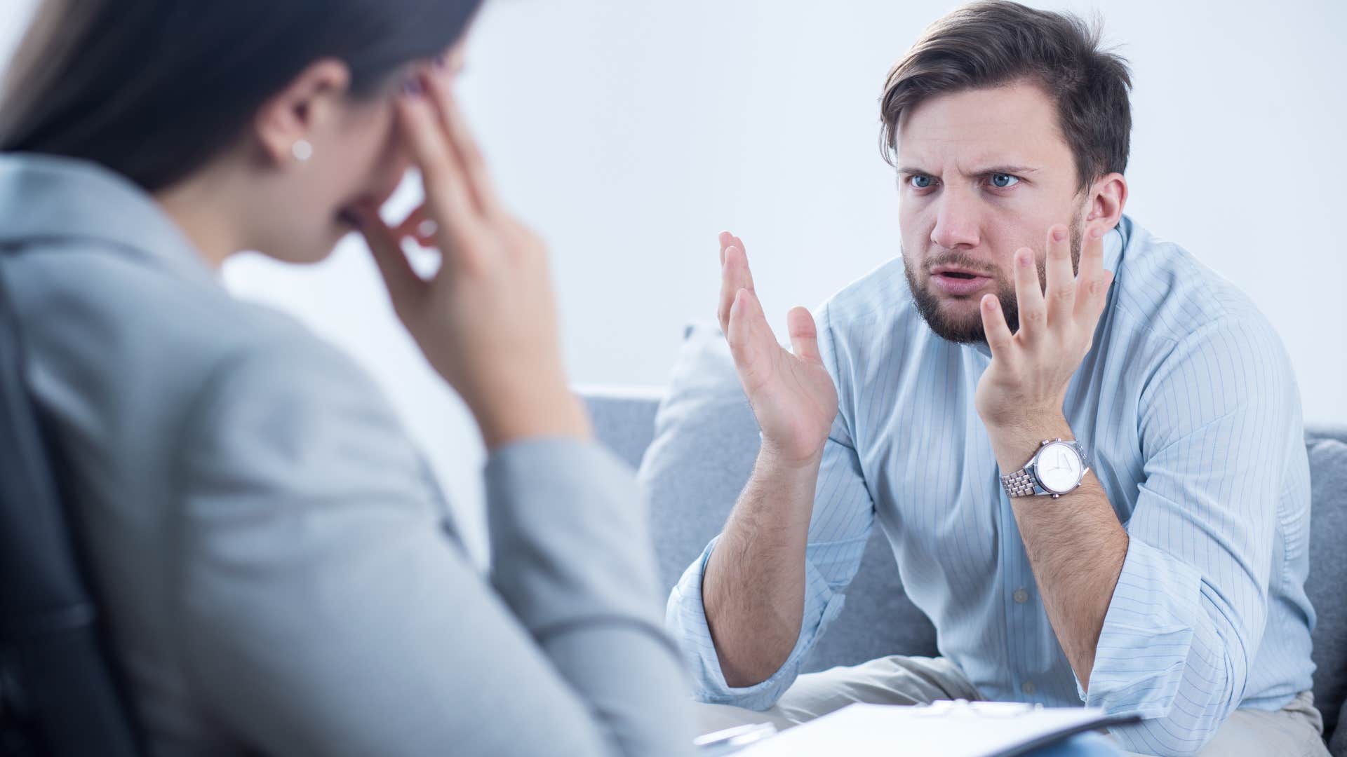man who's a chronic complainer arguing with a co-worker