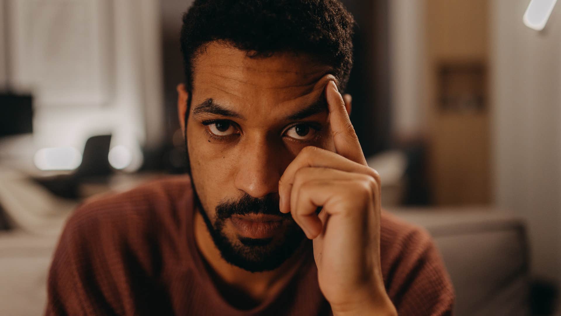 cynical man thinking looking upset about his life