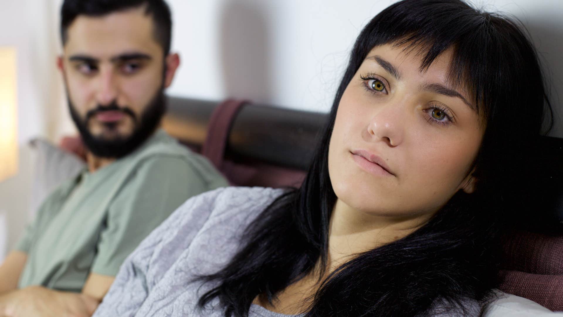 woman sitting next an energy vampire draining her mentally