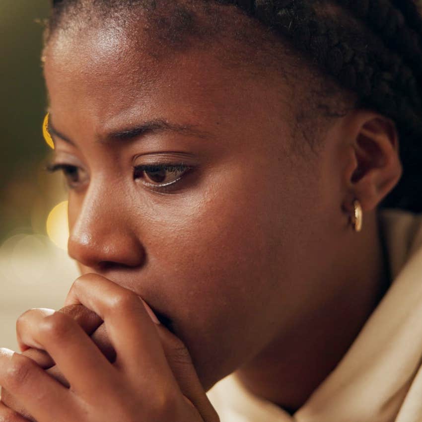 woman who's always expecting the worst looking worried