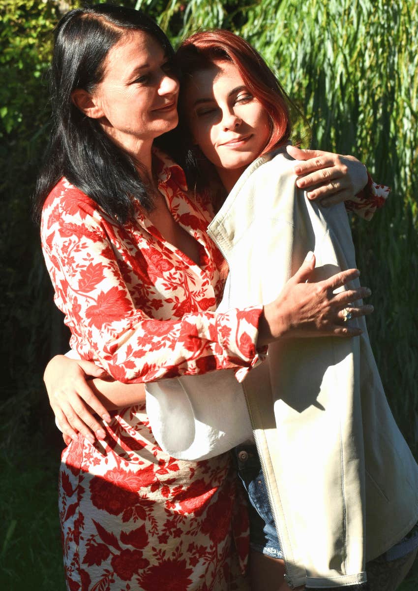 older woman hugging younger woman in support