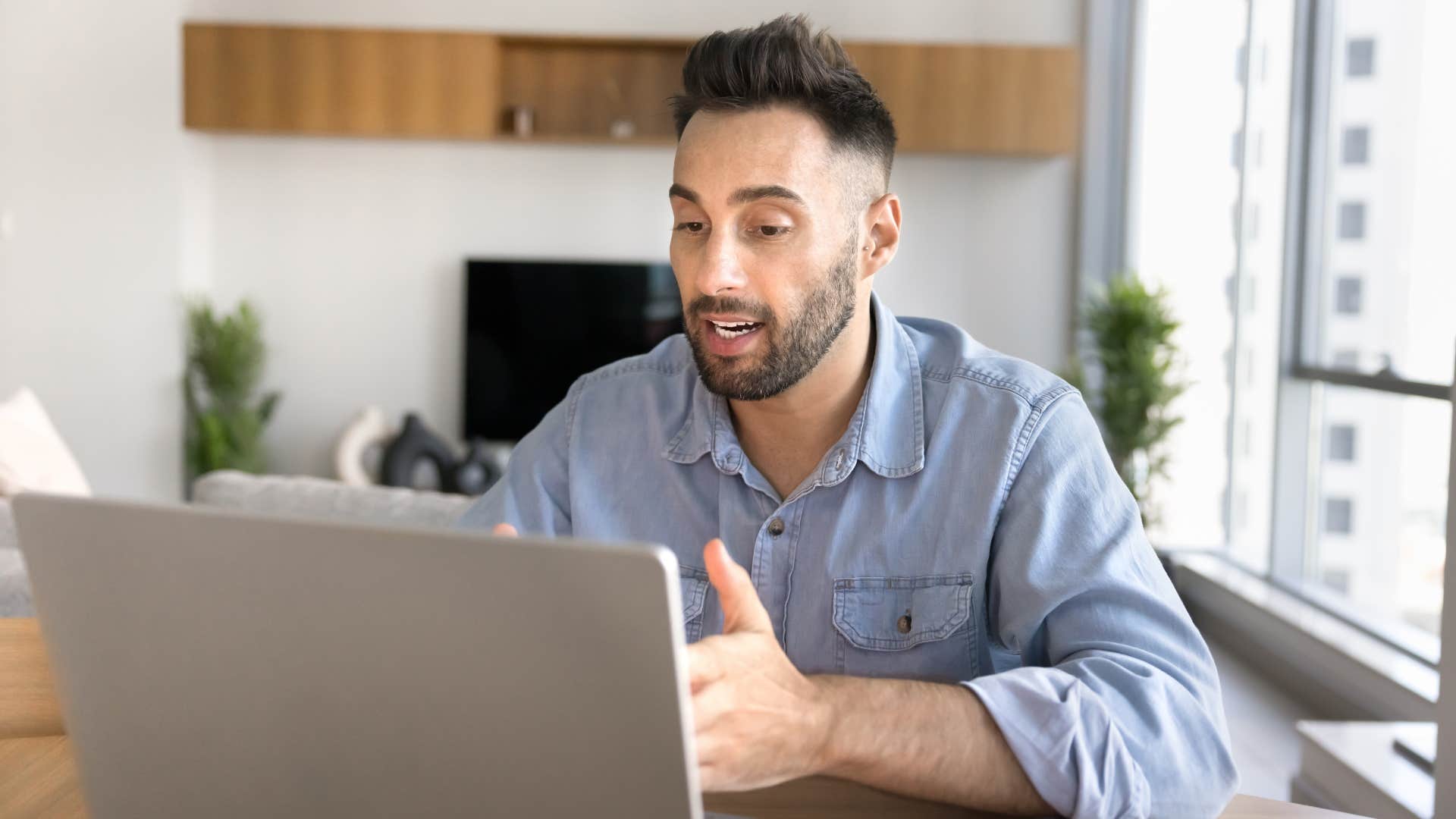 man in blue on laptop meeting saying i'll follow that up through email