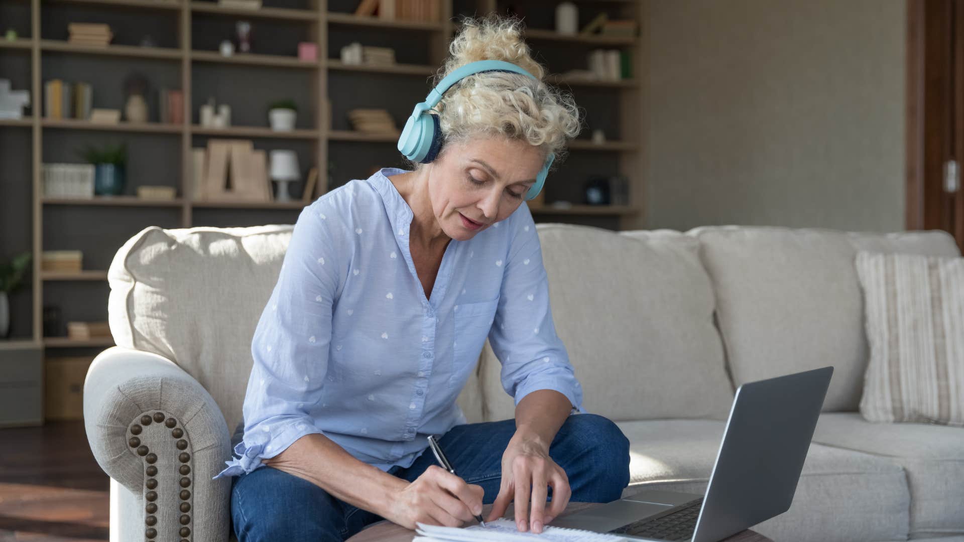 detail-oriented woman working hard on her laptop