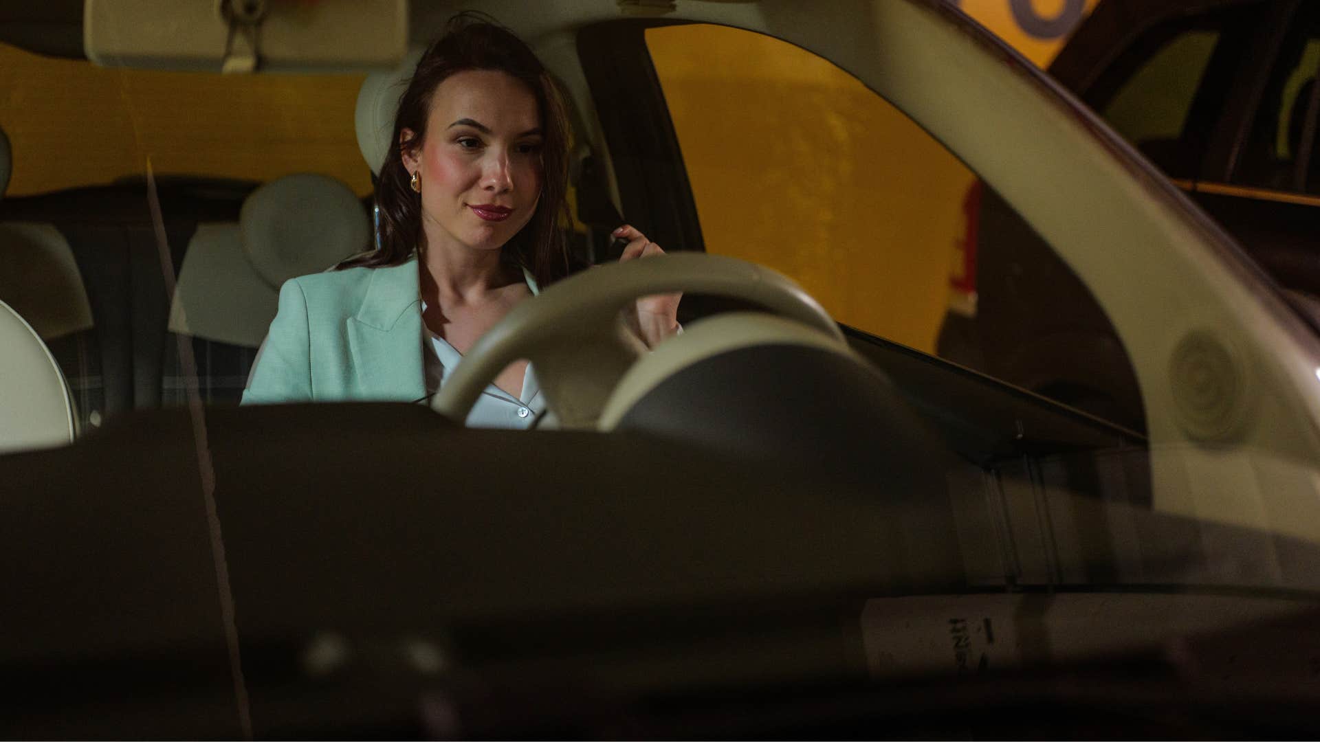 woman on the phone in her car over-preparing for safety reasons