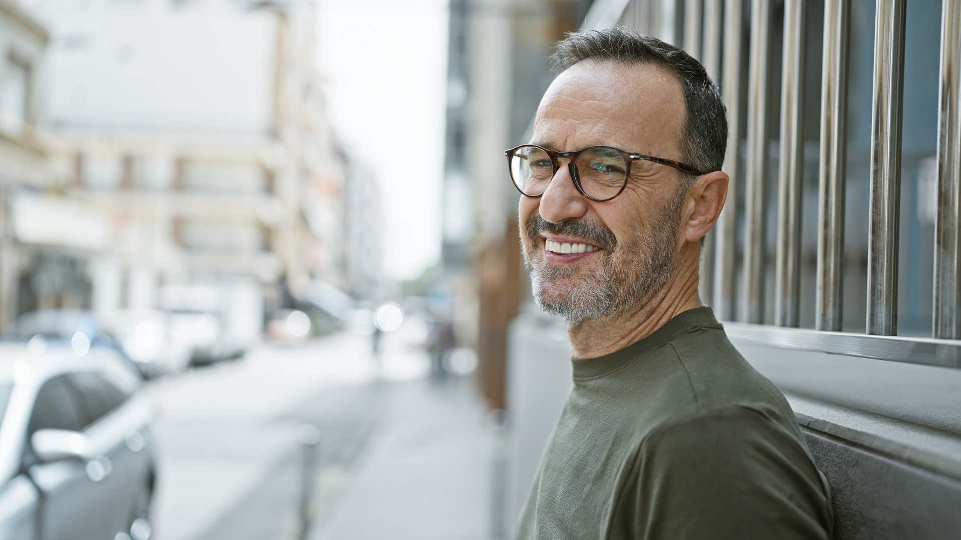 man who is secure and confident standing outside