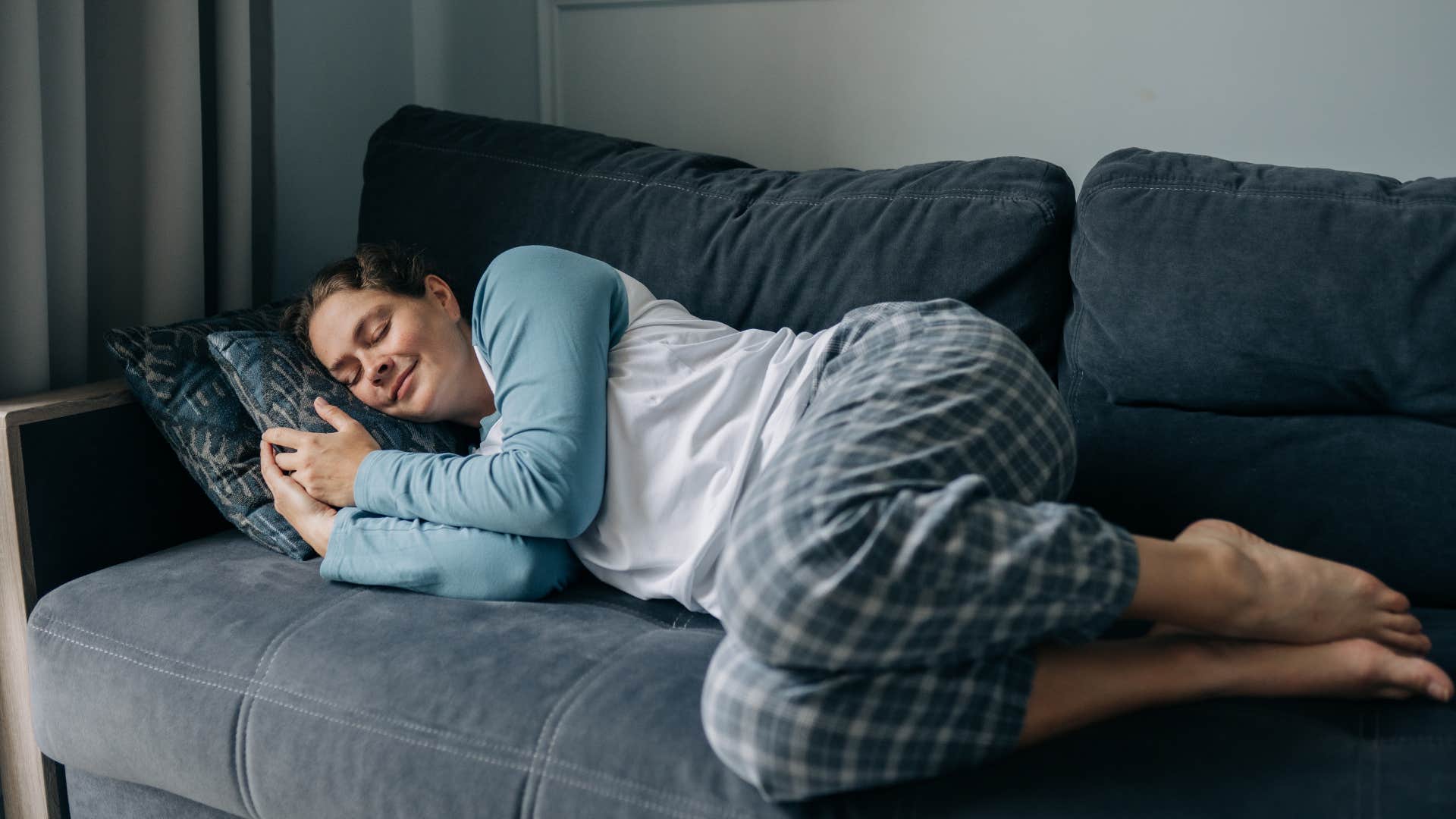 Relaxed person sleeps on couch showing lifestyle change for mental health