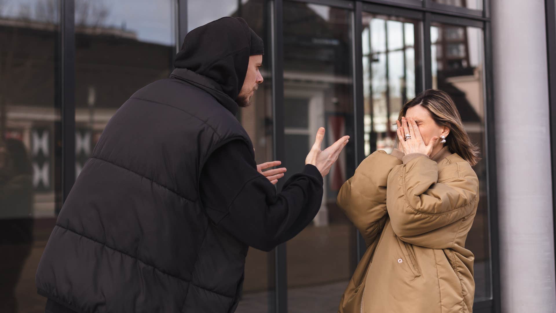 woman in brown coat crying as man says i thought you needed space