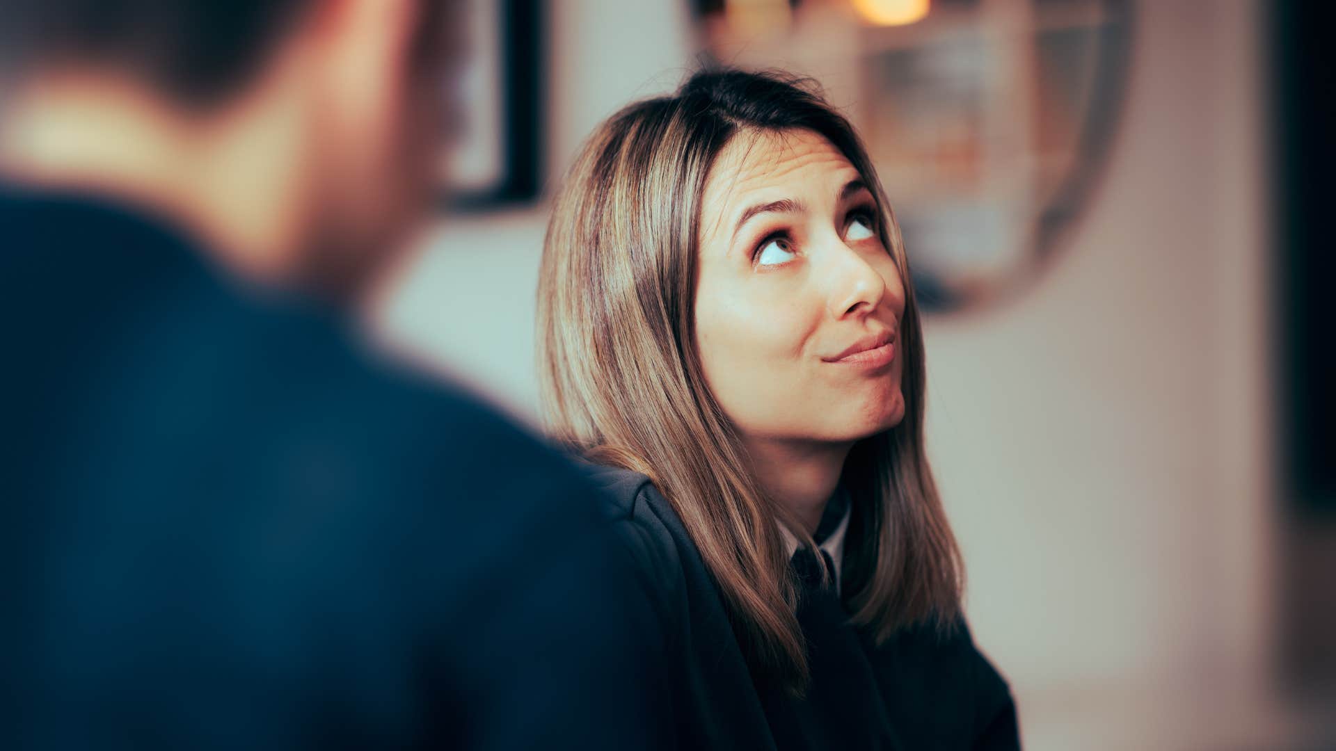 woman looking annoyed as she thinks let's not make this a big deal