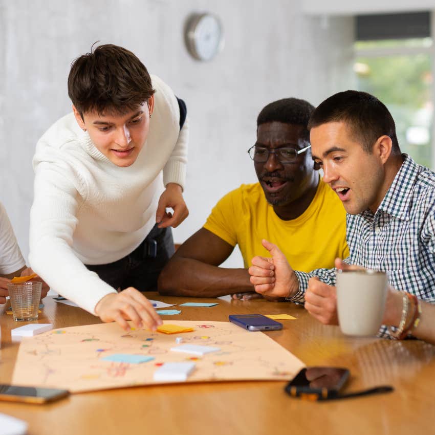Confident man playing board game