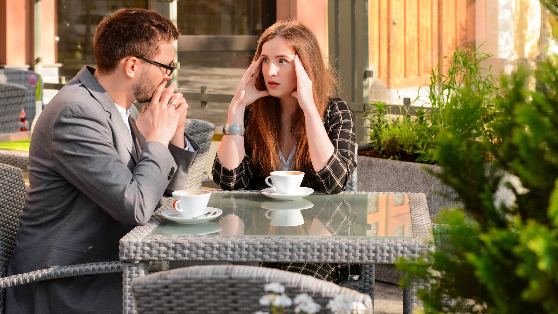 woman looking perplexed as man has discussion around blaming others on date
