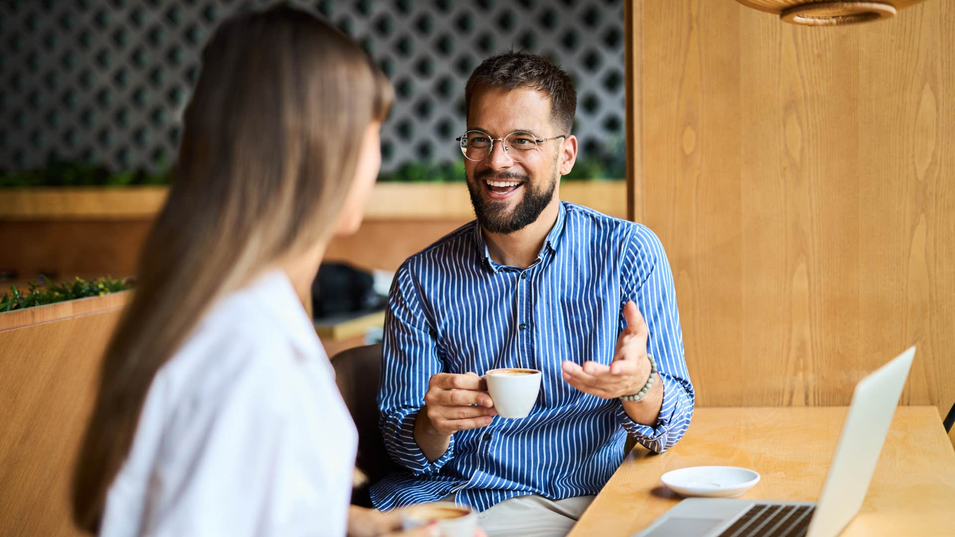 man in blue asking woman What would you do differently next time
