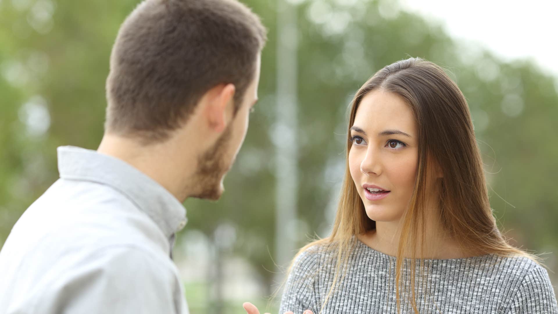 couple talking woman telling man let's catch up later