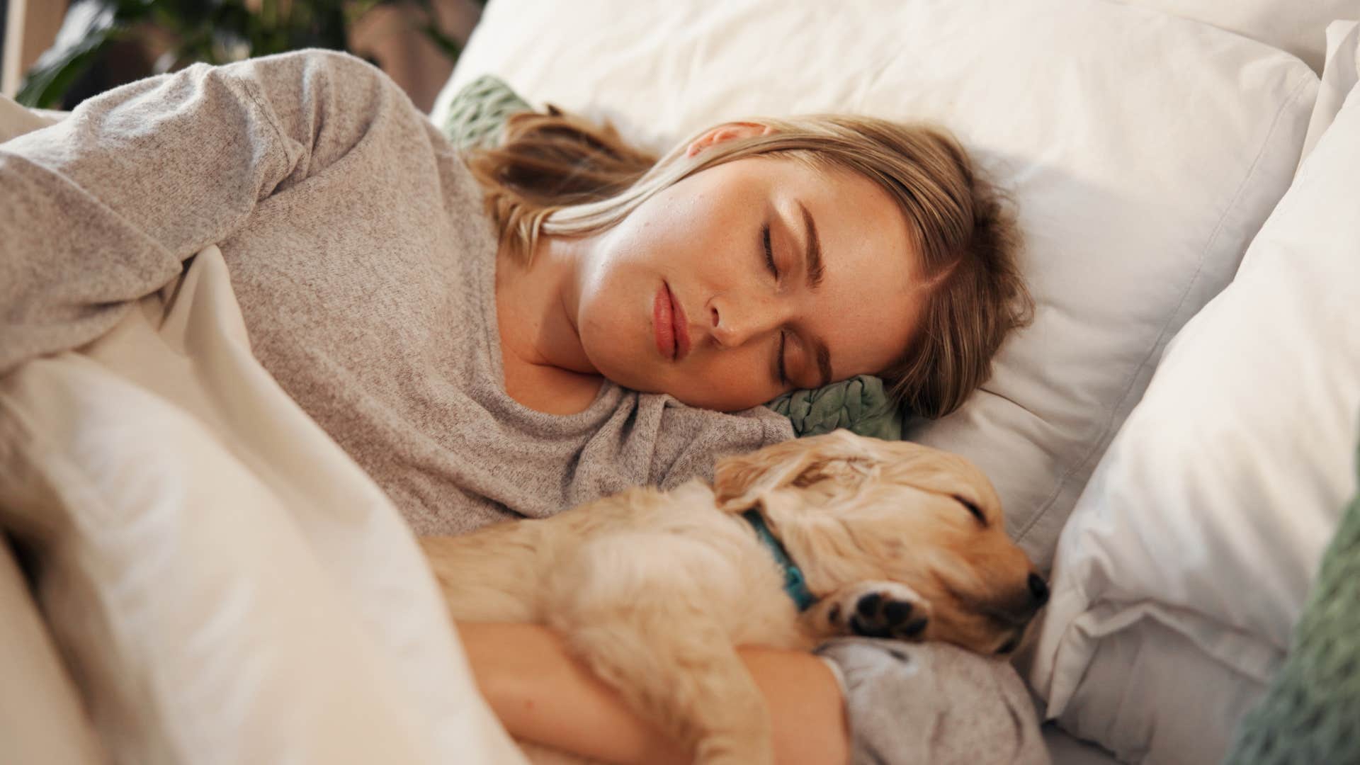 woman taking a nap with dog as she's a peace protector