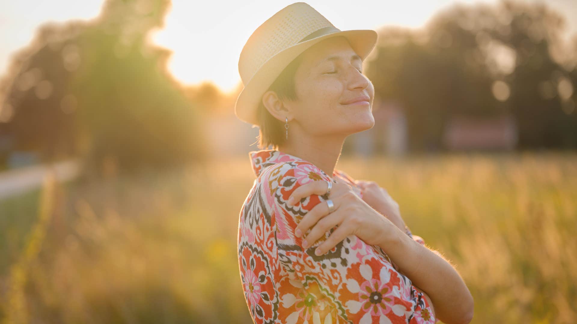 Peaceful person embraces themselves showing thing to rebuild life