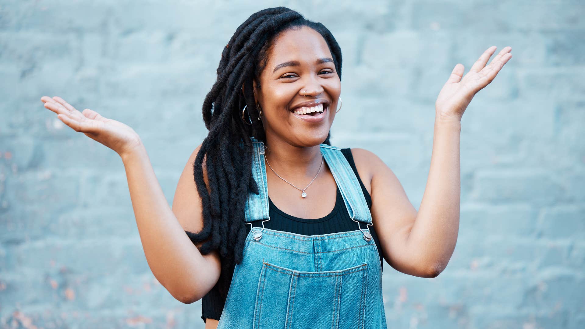 Happy person throws hand up showing things to rebuild life