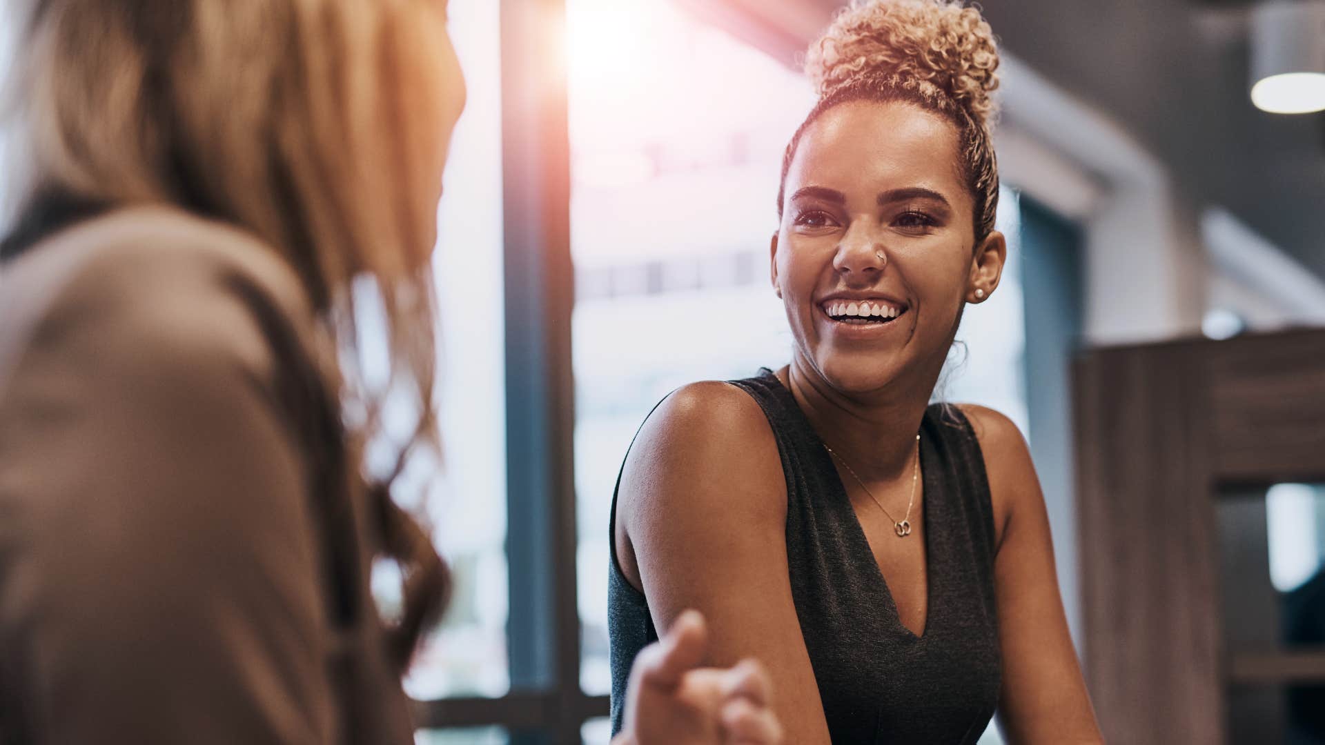 woman who forgets names curiously talking to colleague