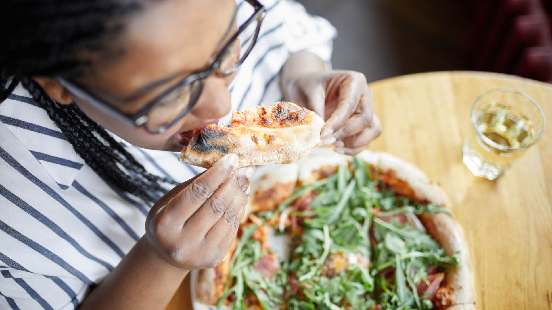 woman who almost never eats her meals at home because she enjoys nights out