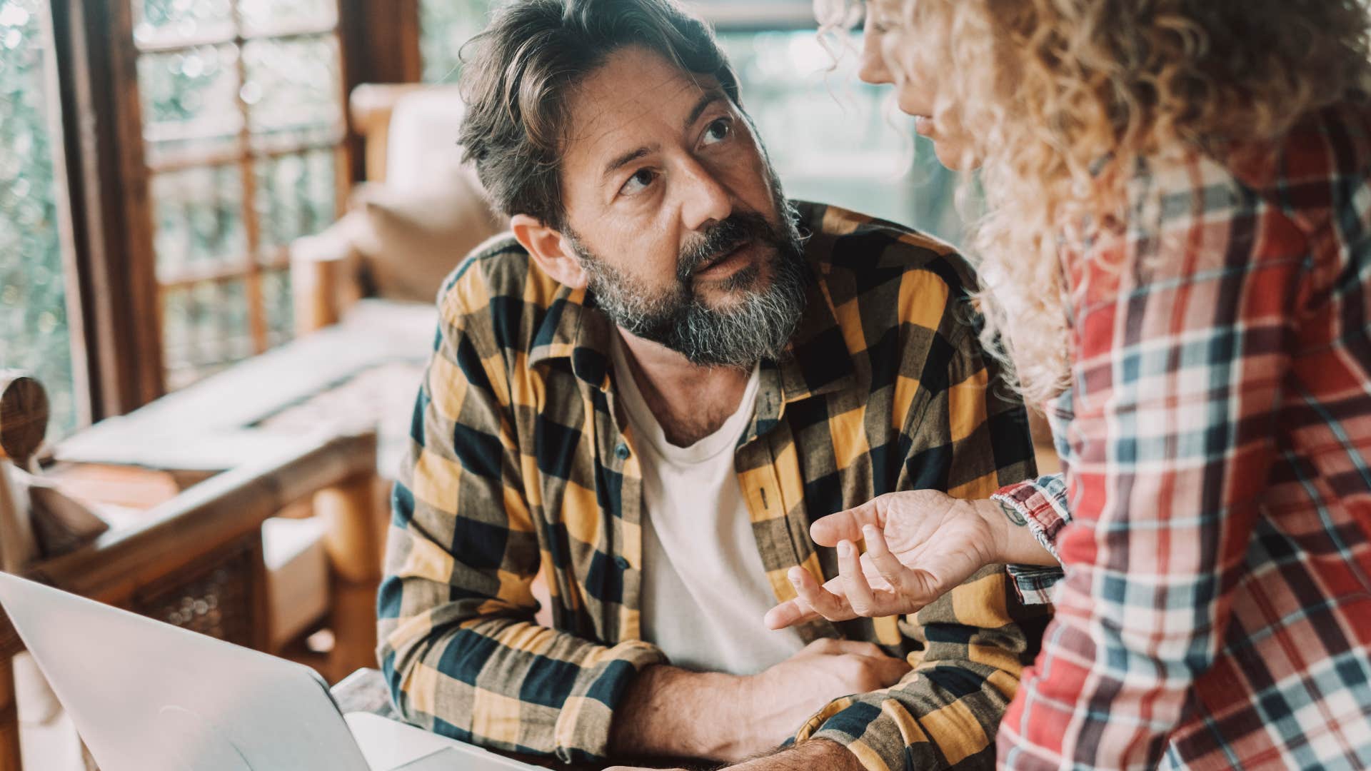 man telling partner I'm playing devil's advocate during discussion