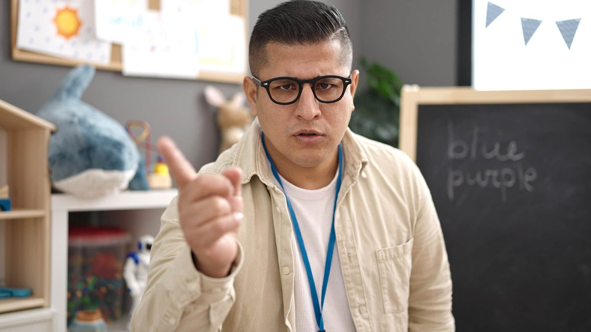 annoying man about to interrupt a conversation at work