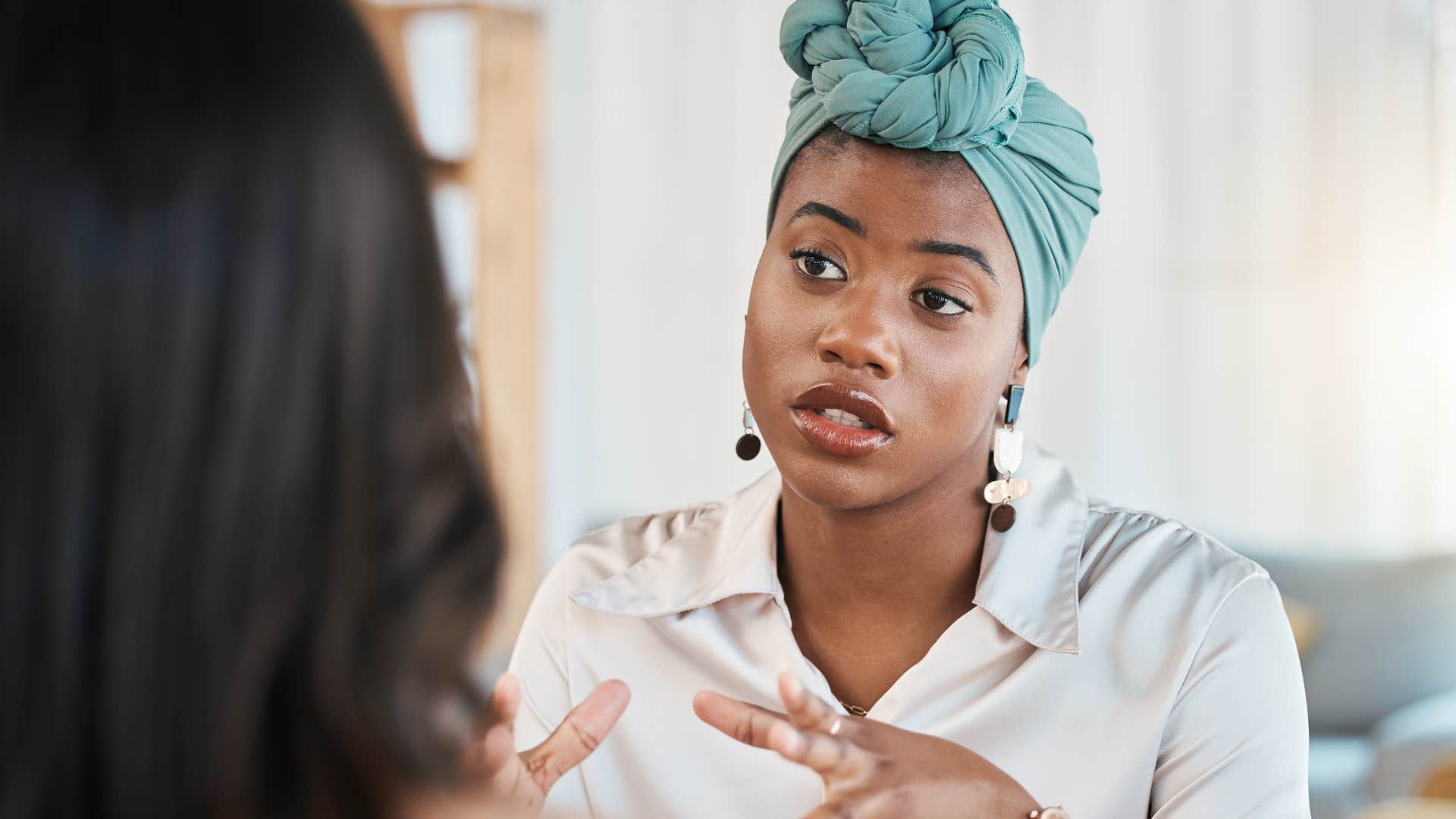 woman having conversation with friend