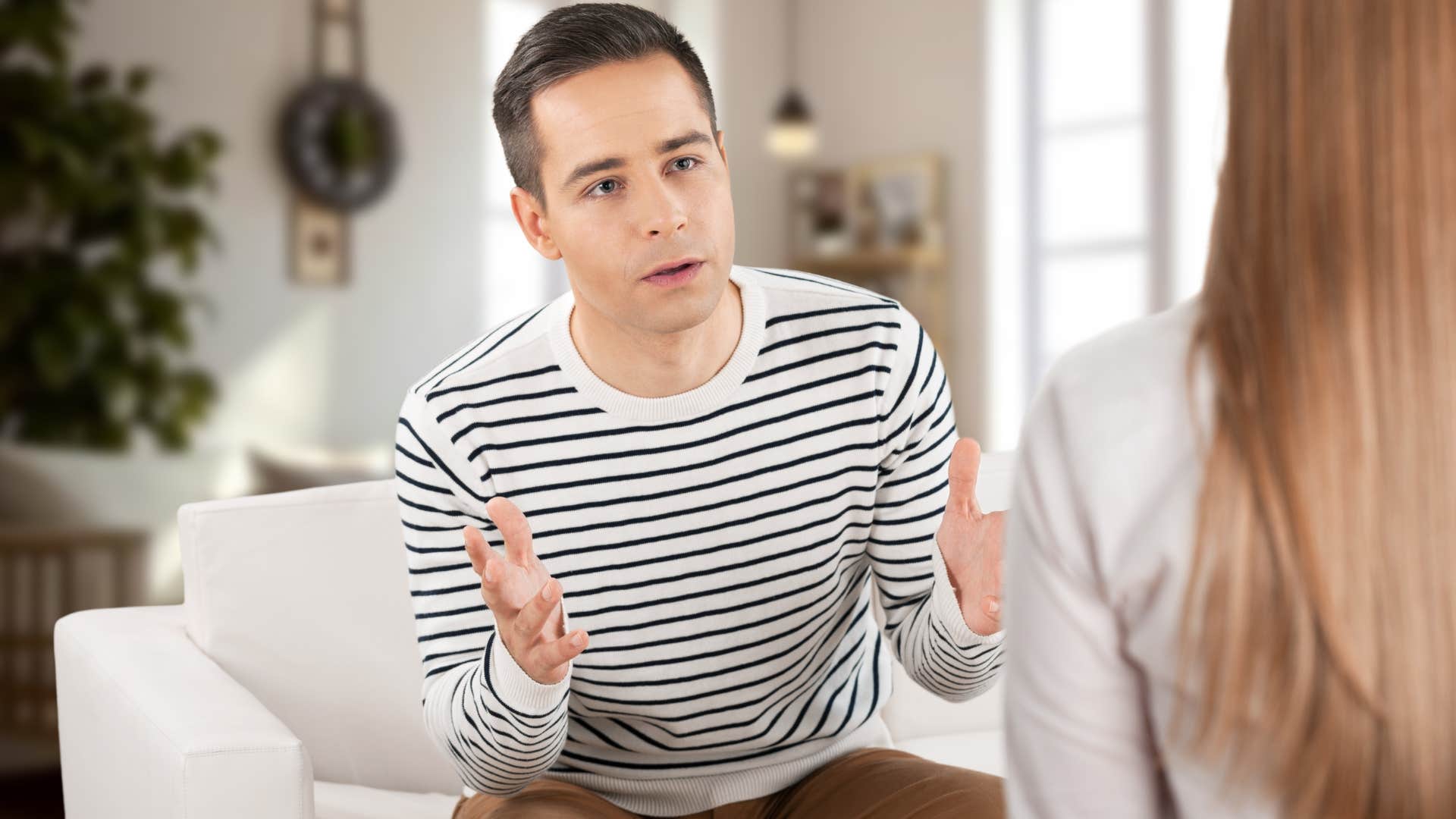 Upset man saying "you just don't understand" to his wife.