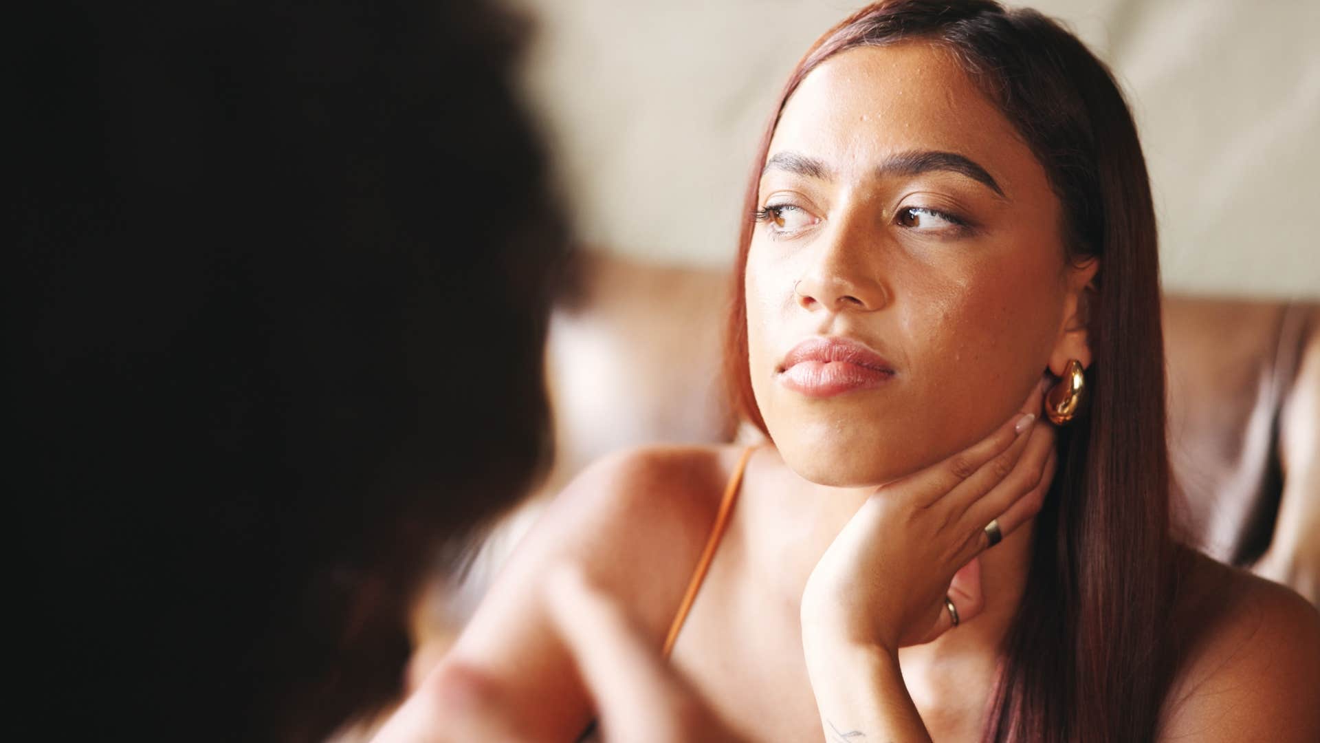 woman feeling drained by superficiality in conversation