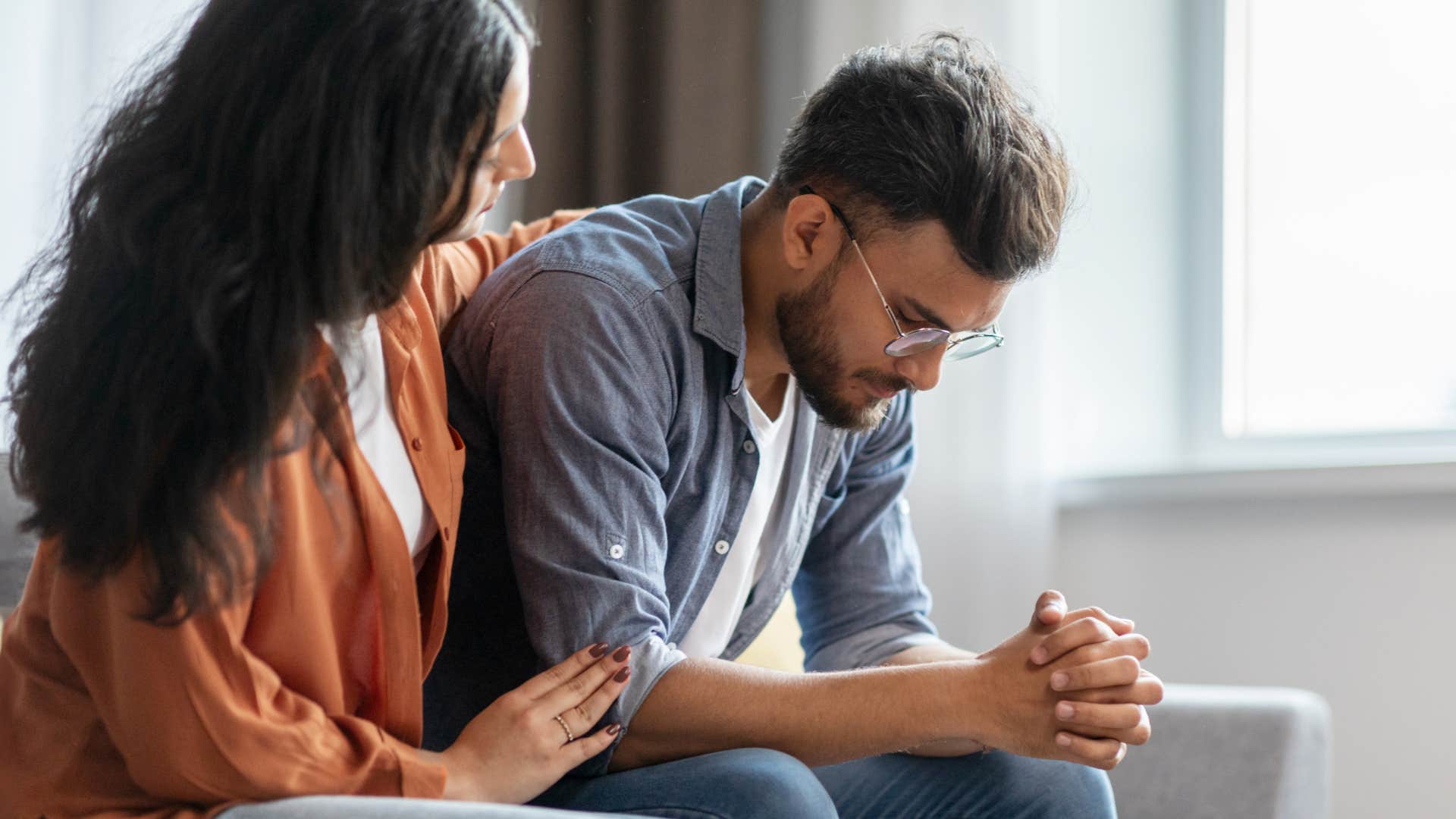 forgiving woman comforting her upset husband