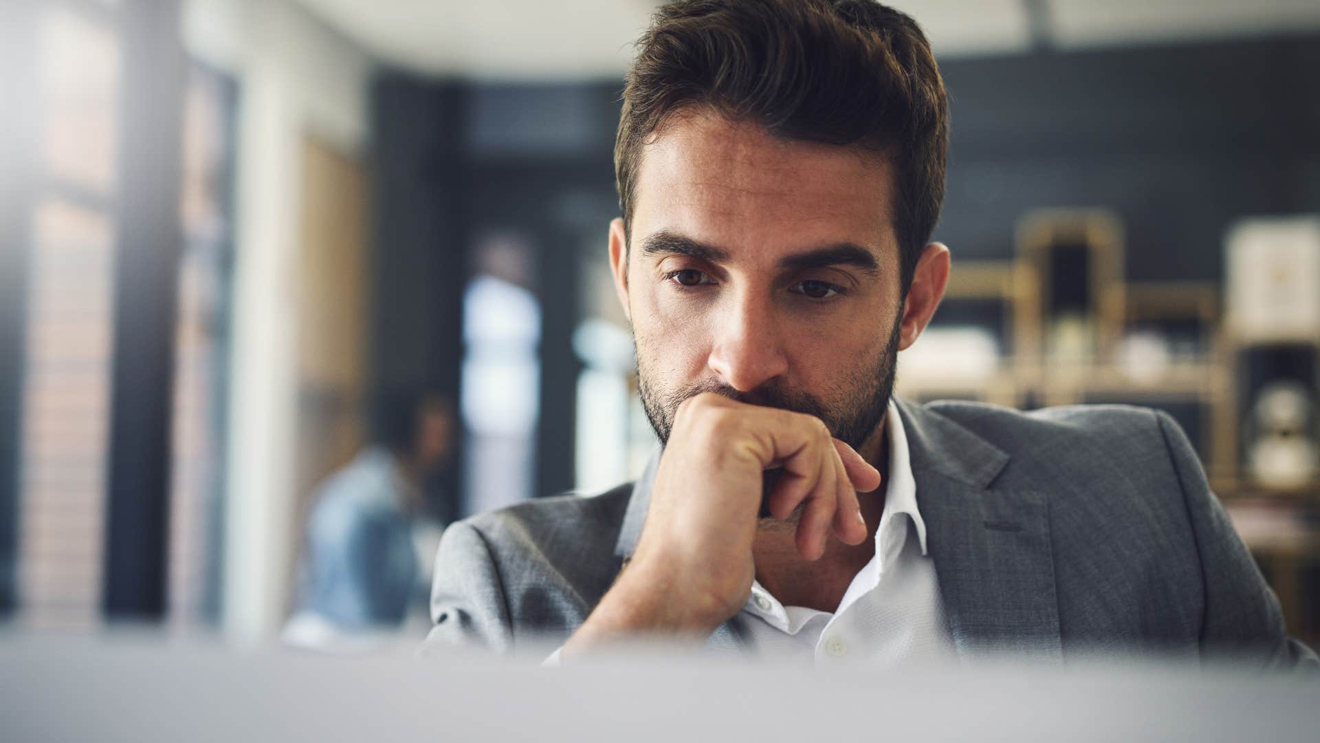 man at working seeking true growth through discomfort