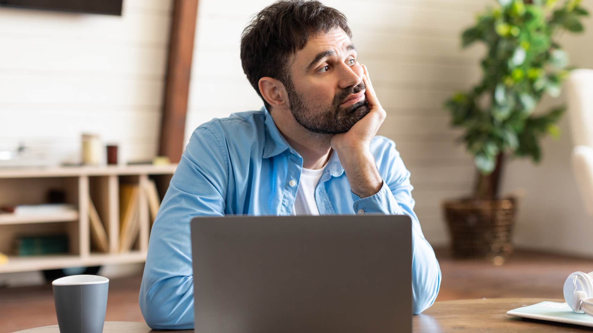 man who is exhausted from doing busy work