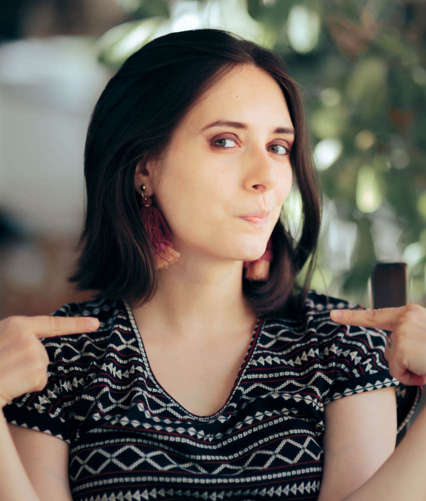 Snide person points at self showing struggle with exhaustion