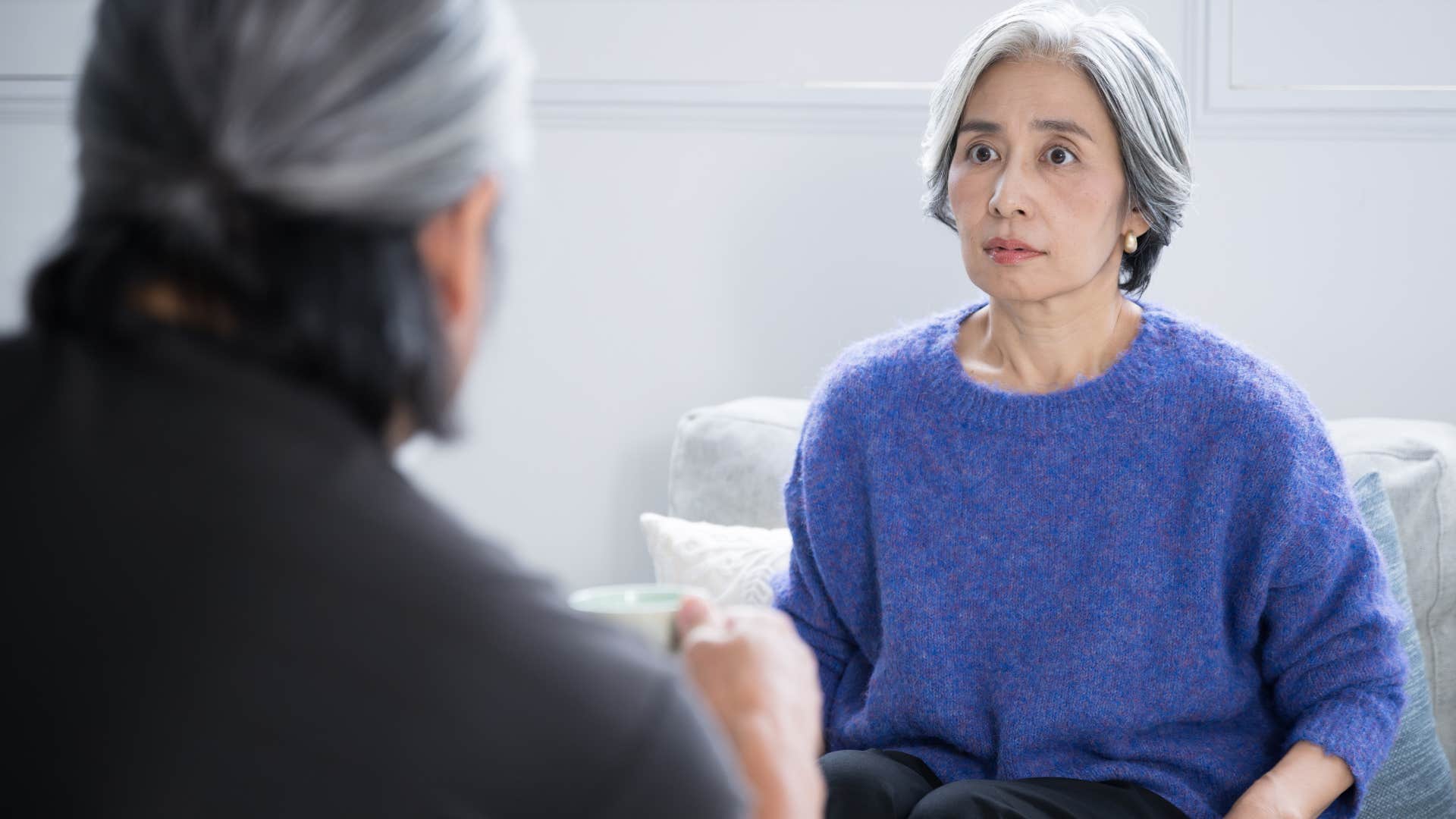 Woman saying "I'm doing my best" to her partner.