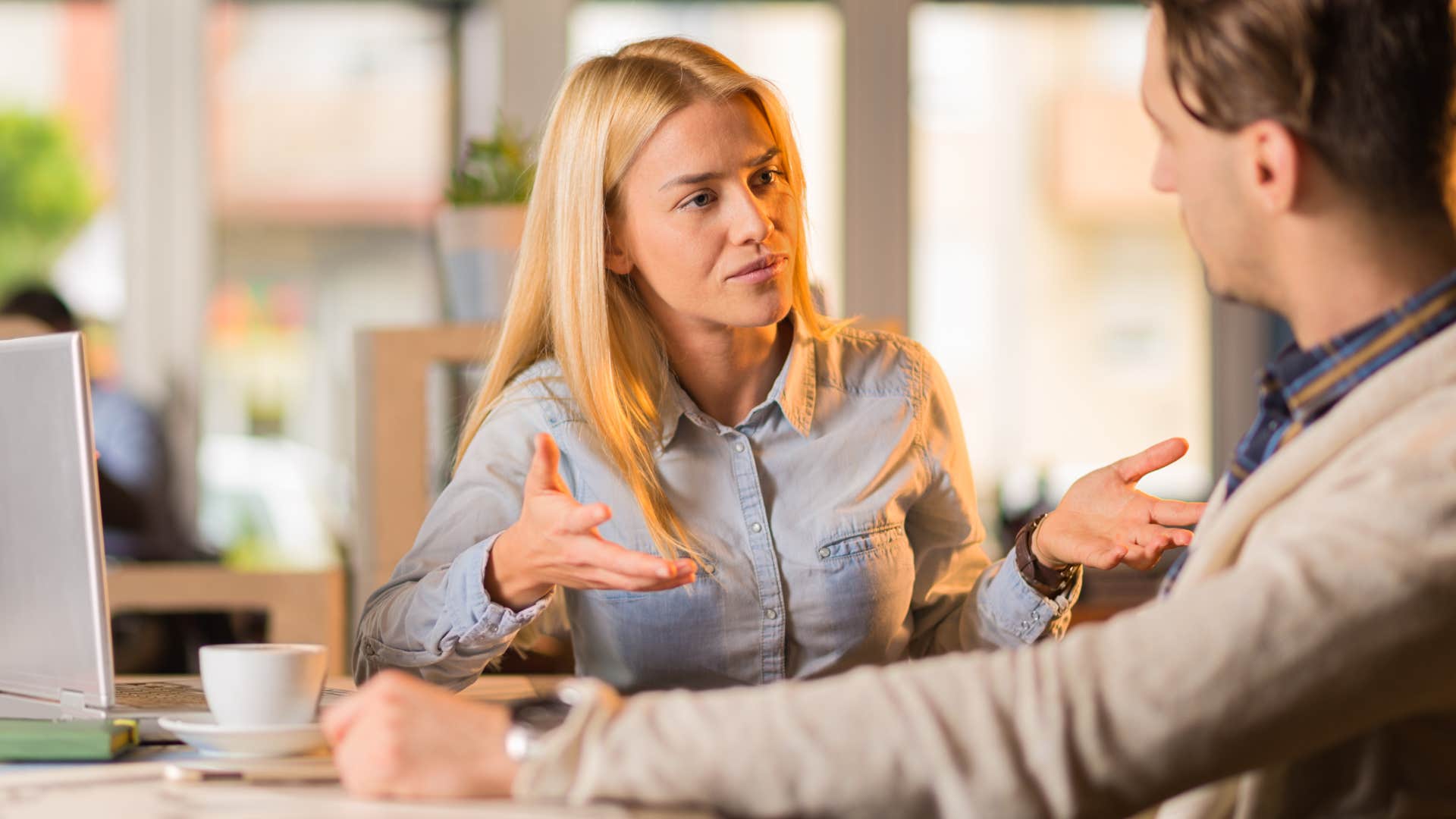 Woman saying "I'm just being honest" to a friend.