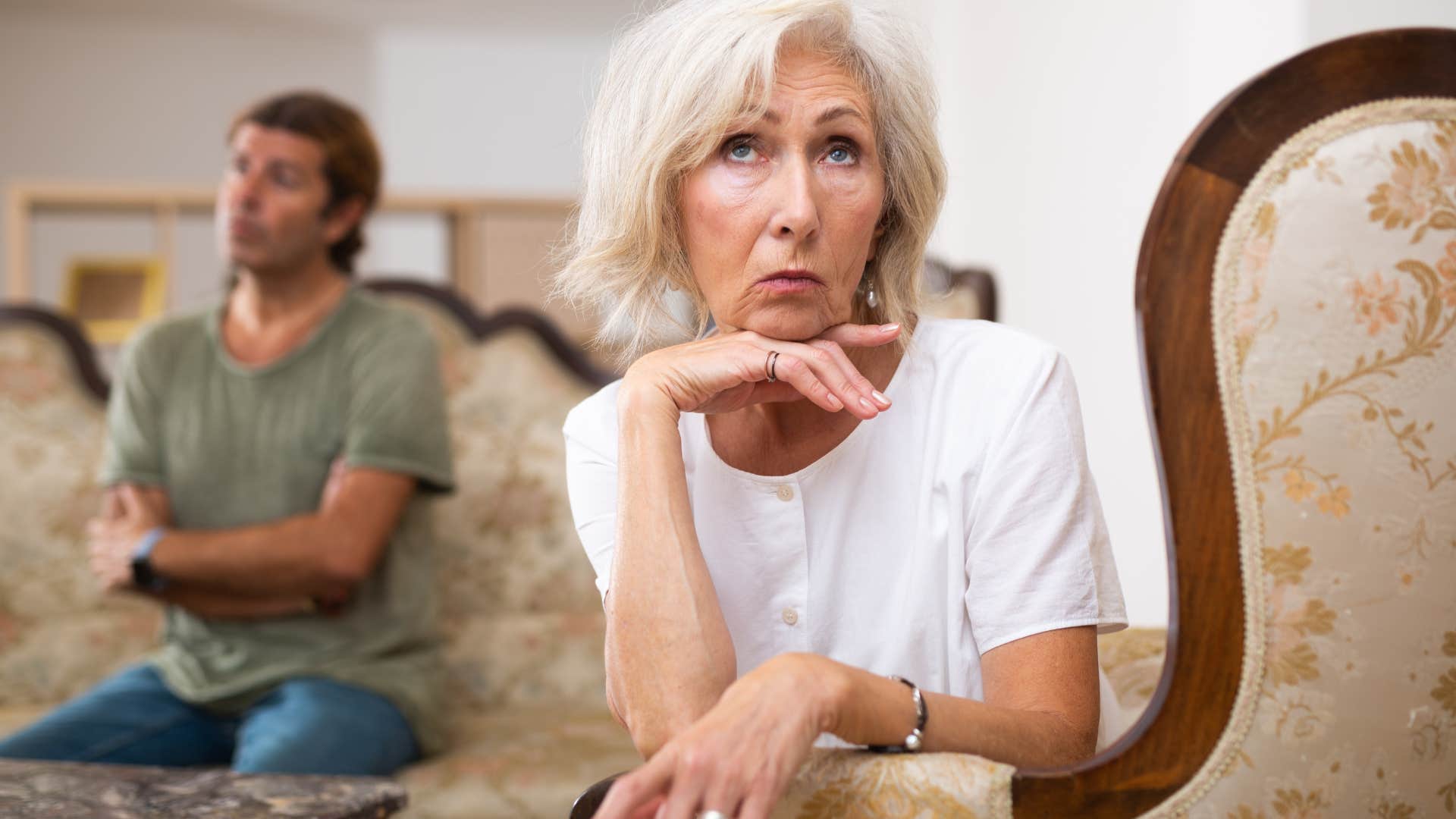 Woman saying "you just don't understand" to her son at home.