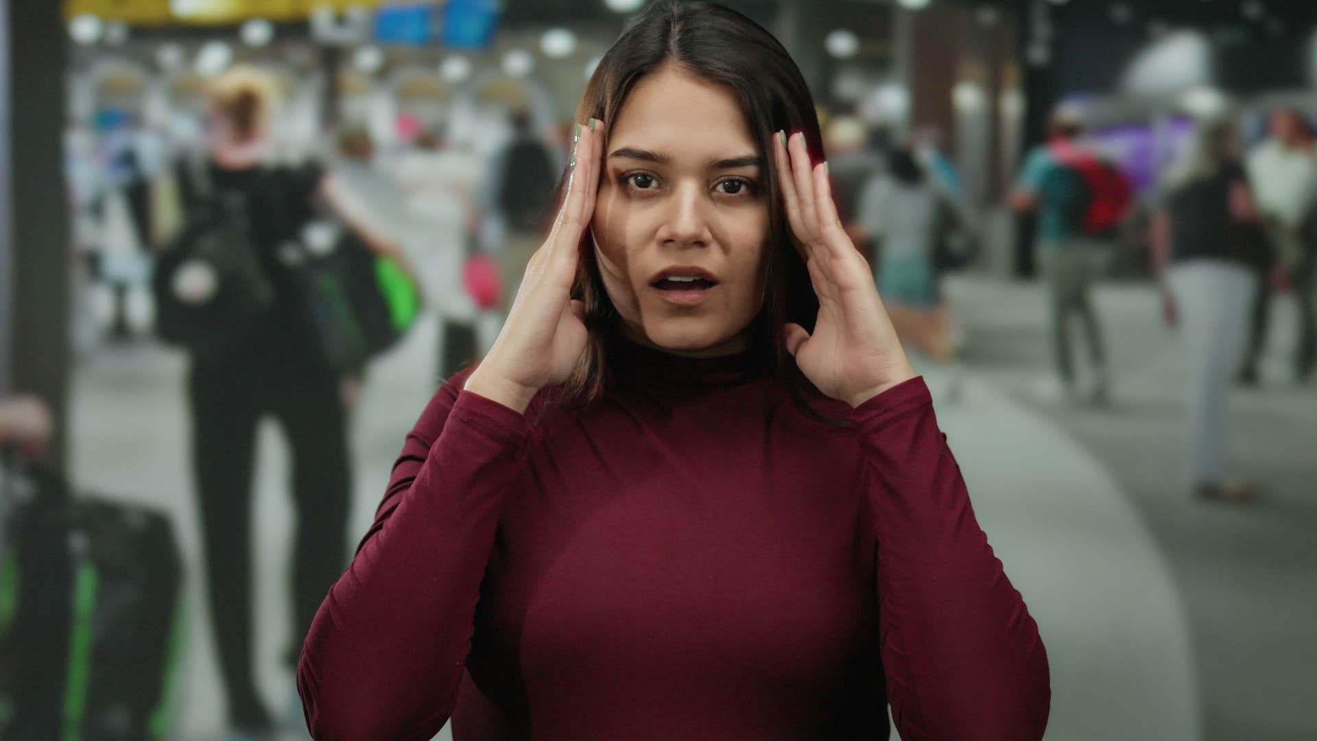 mentally sharp woman annoyed by overly crowded loud space